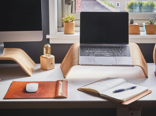 Free A stylish and contemporary home office setup with laptop and desk accessories. Stock Photo